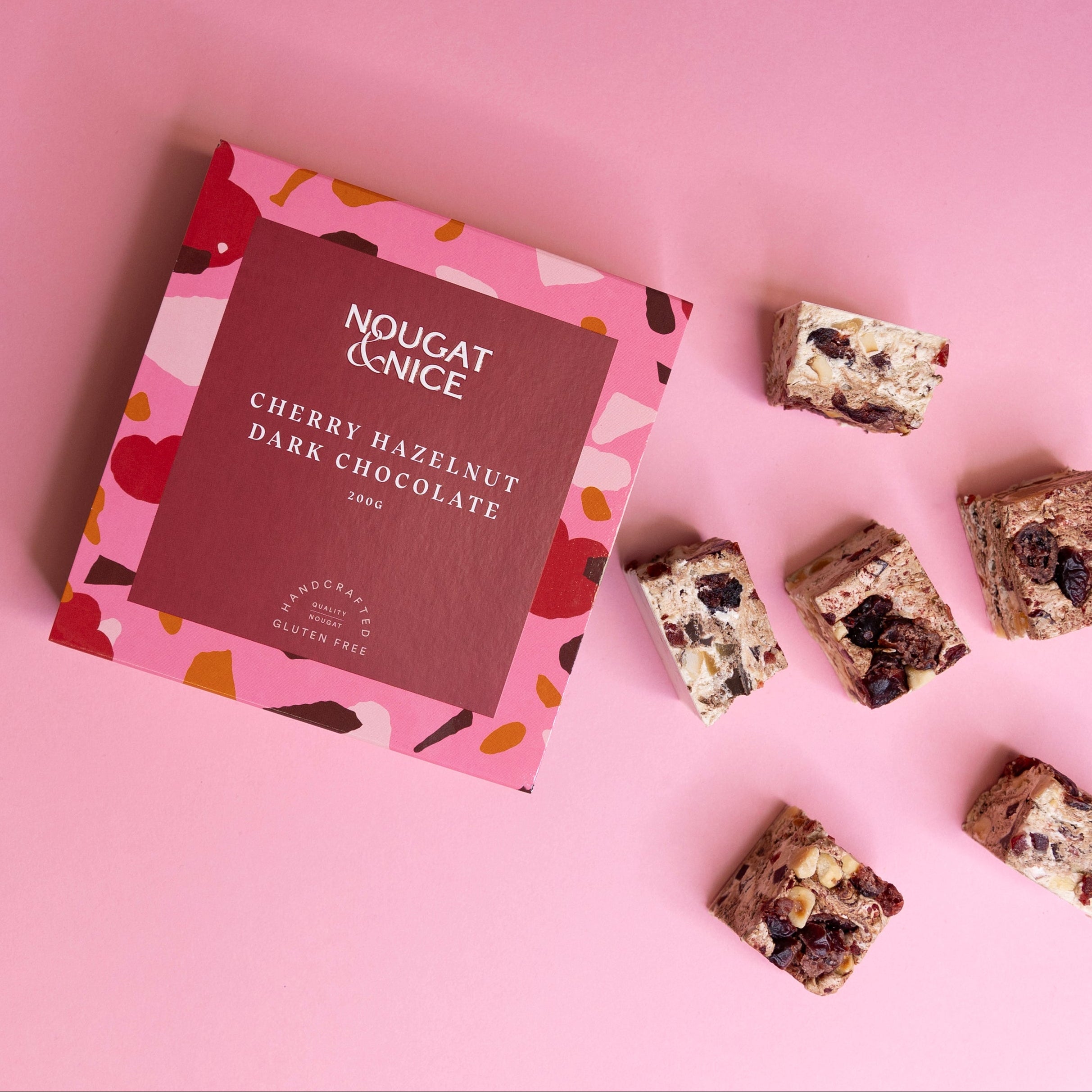 Nougat & Nice chocolate bars on a pink background
